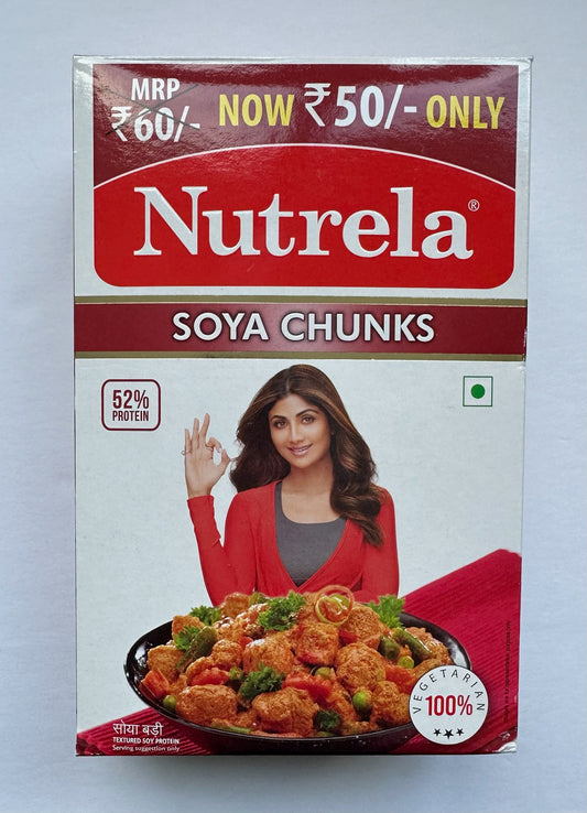 Nutrela Soya Chunks packaging with a woman and food image on a gray background